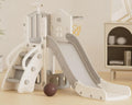 Children's playset with slide and basketball hoop on a light wooden floor.