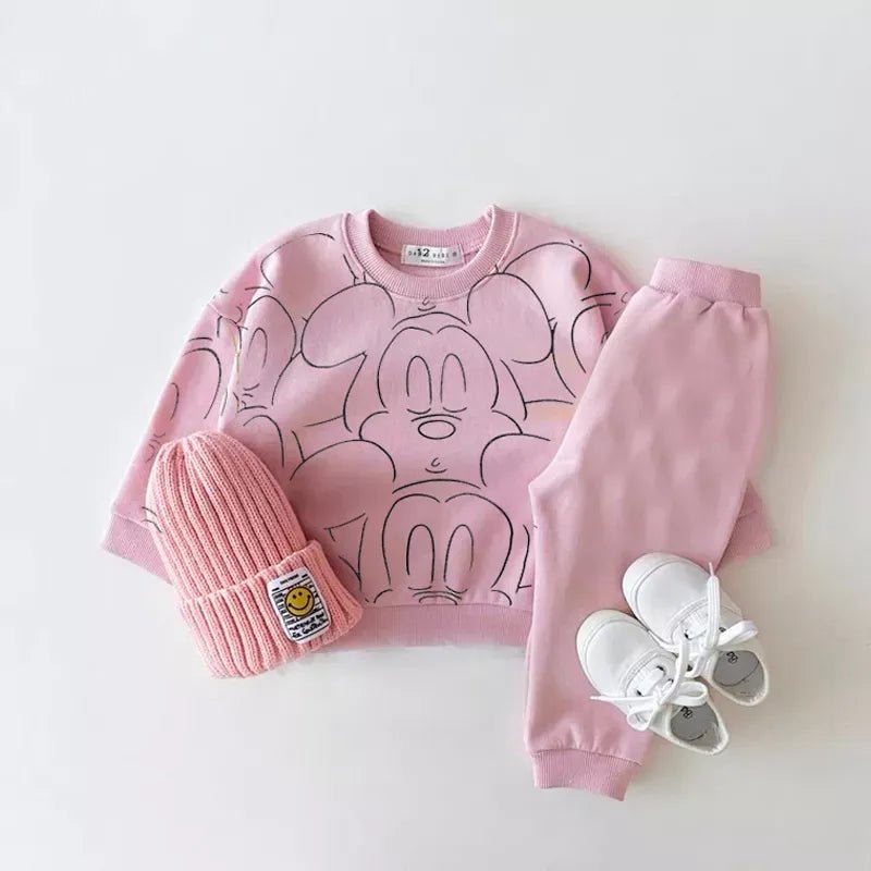 Pink cartoon-themed sweatshirt, pants, beanie, and shoes.
