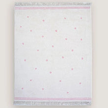 White towel with pink polka dots.