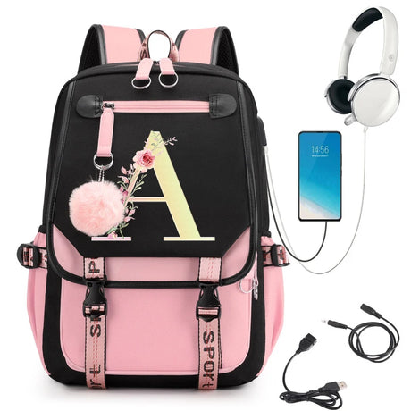Pink and black backpack with floral letter 'A' design, smartphone, headphones, and USB cable