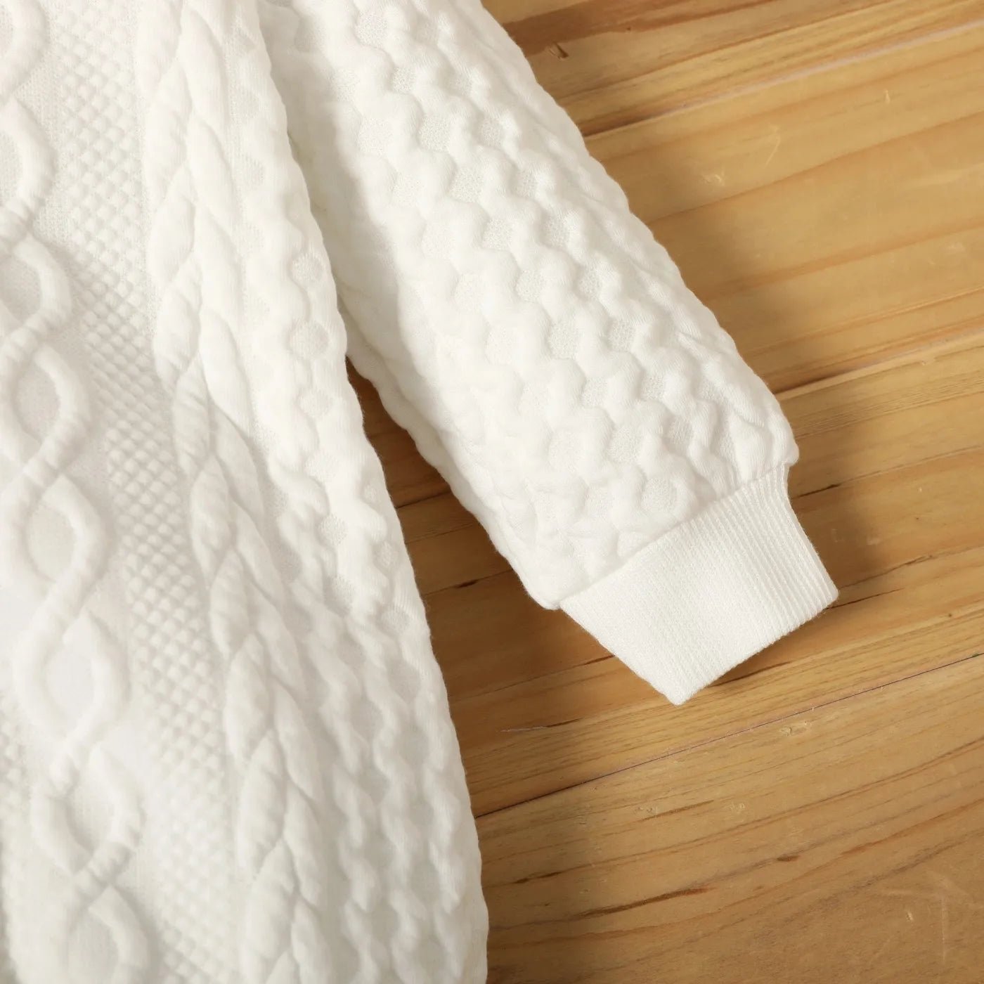 Close-up of a white textured sweater 