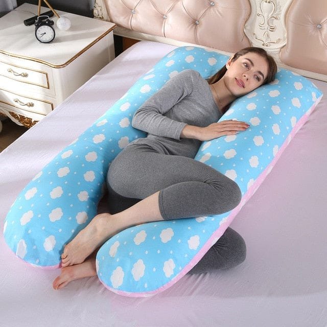 Polka dot U shaped maternity sleep pillow for pregnancy bed comfort and supported resting positions.