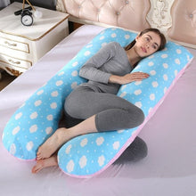 Polka dot U shaped maternity sleep pillow for pregnancy bed comfort and supported resting positions.
