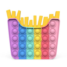 Colorful pop-it toy shaped like a basket of fries on a white background