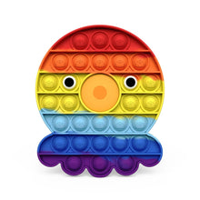 Colorful pop-it toy with rainbow pattern on a white background