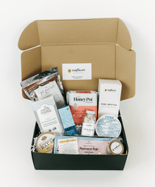 Open box containing various products with visible branding.