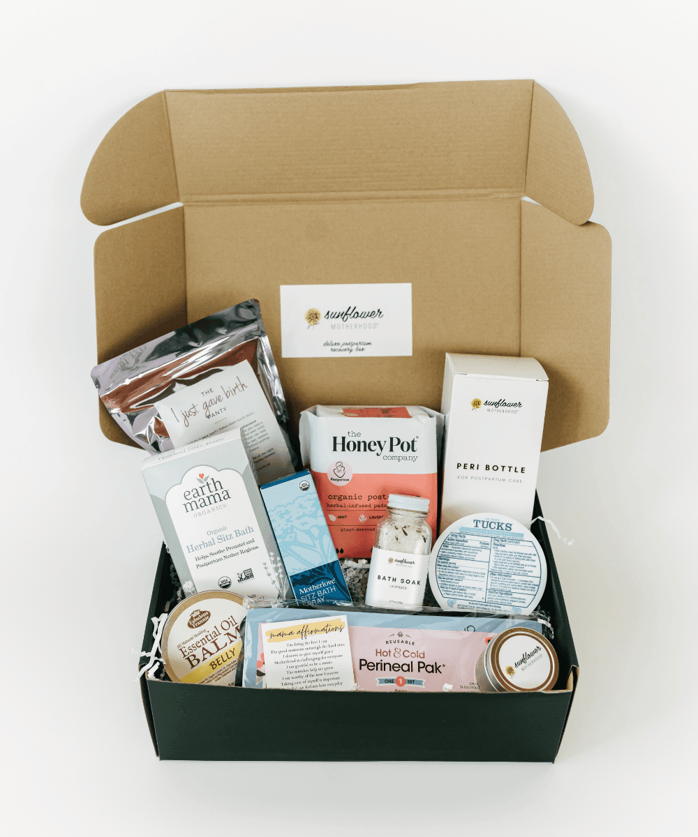 Open box containing various products with visible branding.