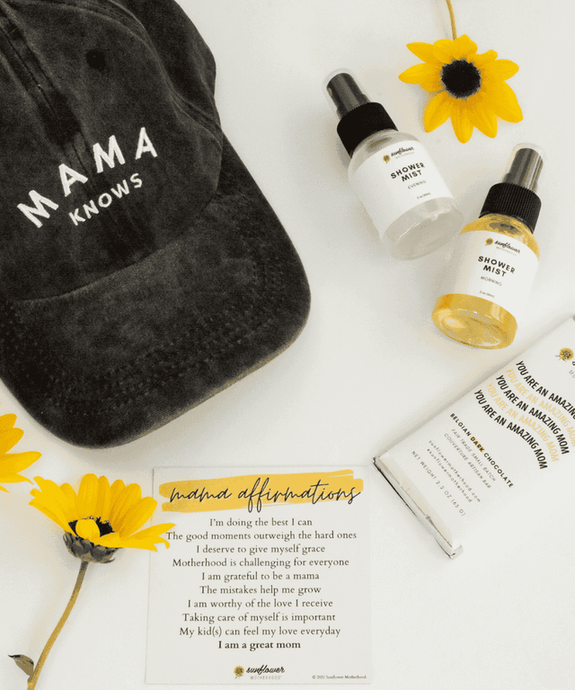 Black 'Mama Knows' cap with Shower Mist bottles and sunflowers 