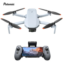 Potensic ATOM 2 4K HDR lightweight camera drone paired with a smartphone controller for mountain flights.