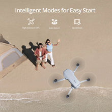 Potensic C0 ATOM mini drone on a sandy beach near a tent, highlighting intelligent flight modes.