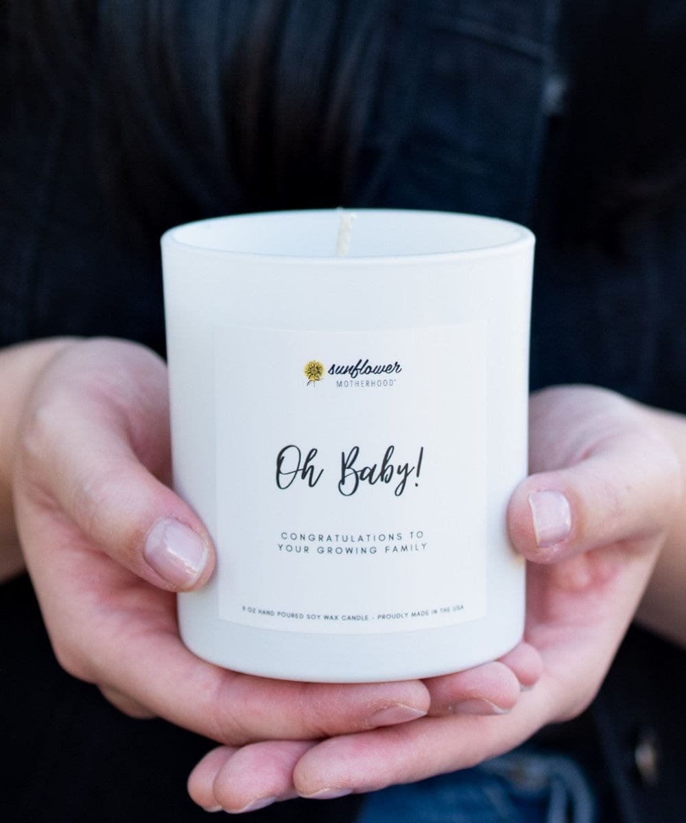 Oh Baby Pregnancy Candle held in hands, a calming scented candle for unwinding during pregnancy and postpartum rest.