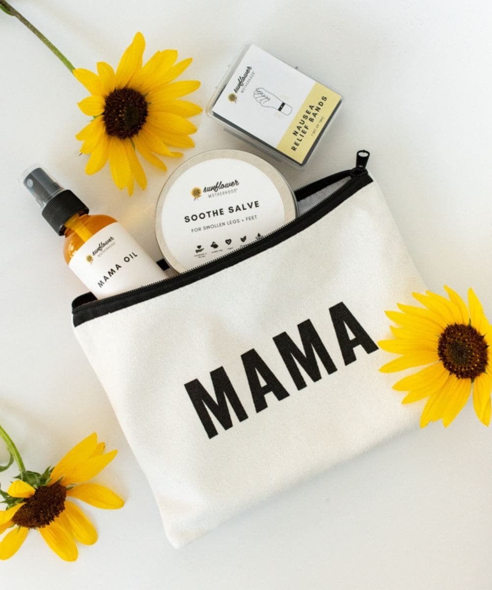 White pouch with 'MAMA' printed on it, containing skincare products