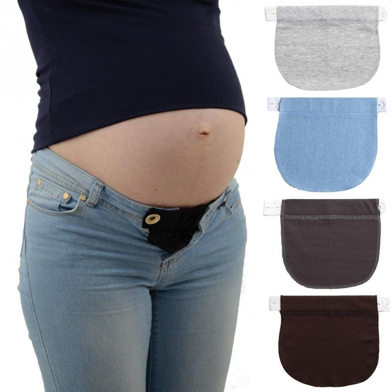 Pregnant person wearing a black maternity support with color swatches.