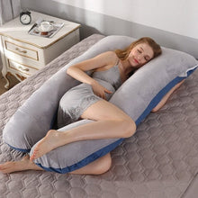 U shaped pregnancy body pillow supporting the back and belly for comfortable sleeping positions through every trimester.