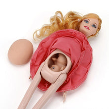 Pregnant doll with removable belly and tiny baby inside for pretend play and new sibling stories.