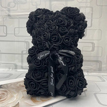 Black rose teddy bear with a black ribbon.
