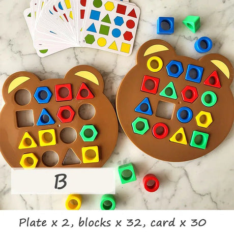 Educational toy set with bear-shaped plates, colorful blocks, and a card on a marble surface.