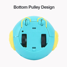 Underside of a blue owl toy showing two black wheels and the bottom pulley design