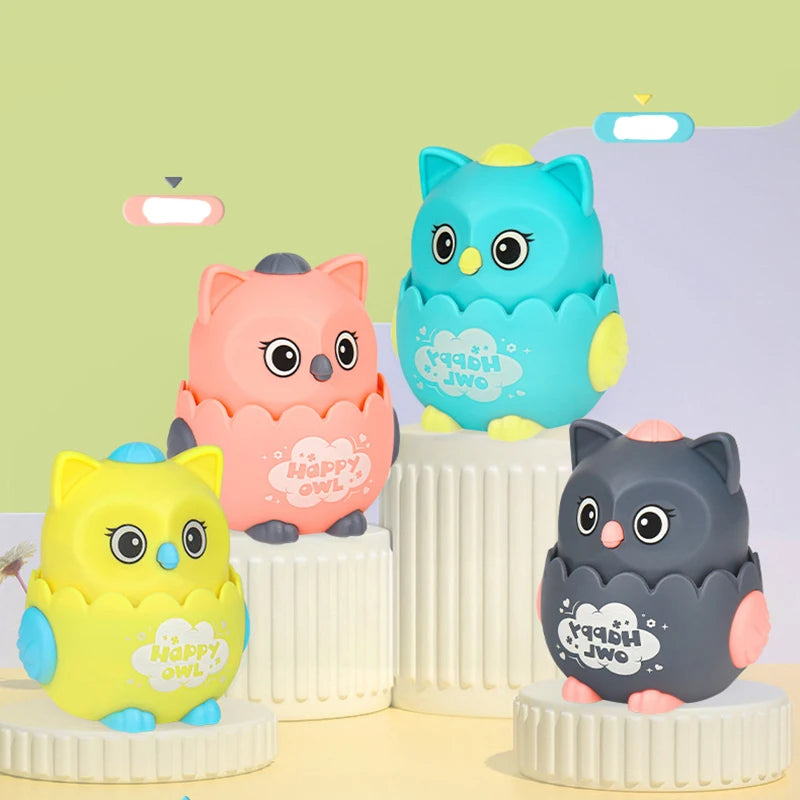 Pink, teal, yellow and grey owl toys on cream pedestals against a pastel background
