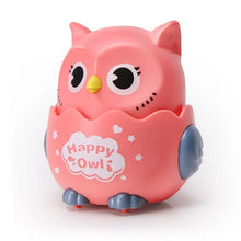 Pink Happy Owl toy with grey-blue wings on a white background