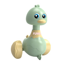 Green press-and-swing rocking duck toy on a plain white background