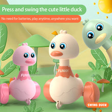Pink, cream and green swing duck toys in a garden scene