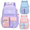 Set of three colorful backpacks with rainbow designs.