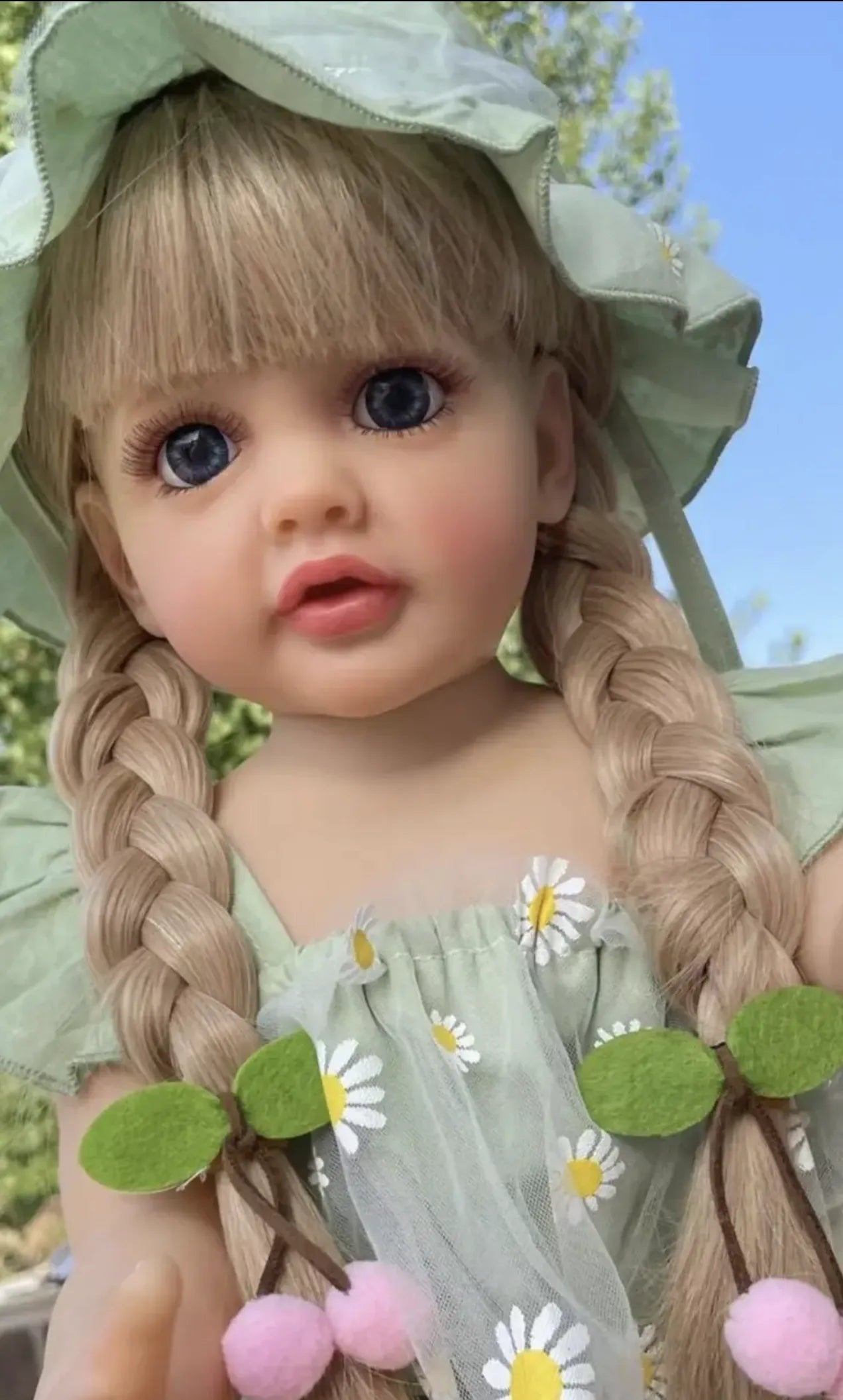 Princess Betty Reborn Doll 55CM silicone baby doll with braided hair photographed outdoors for display, styling, and holiday gifting.