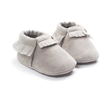PU suede leather newborn baby moccasin shoes shown in a flat lay for baby shower gift presentation.