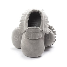 PU suede leather newborn baby moccasin shoes shown with gift packaging for newborn baby showers.