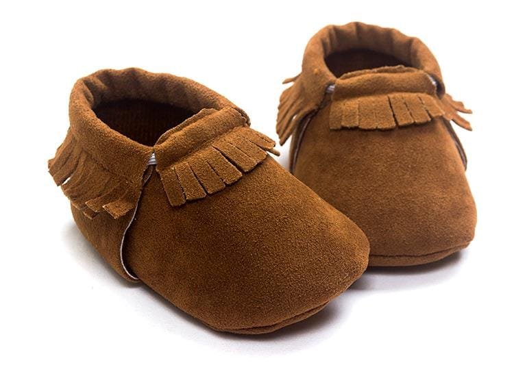 PU suede leather newborn baby moccasin shoes texture detail highlighting the soft suede material.