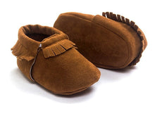 PU suede leather newborn baby moccasin shoes viewed from above showing the soft suede upper for daily wear.