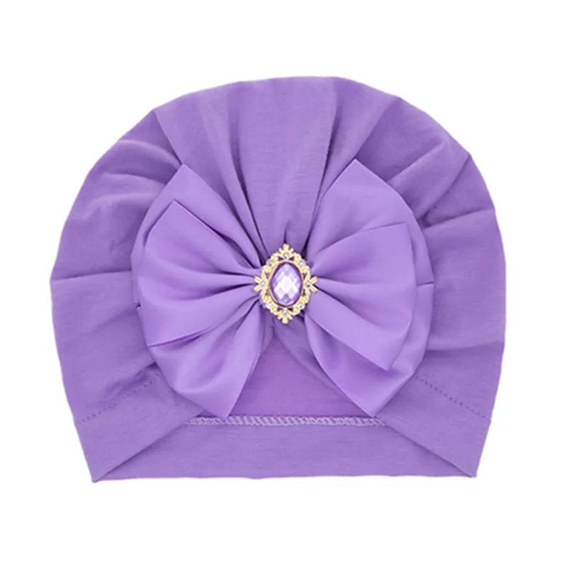 Shiny Rhinestone Bowknot Baby Turban in purple with large bow for special occasion baby styling.