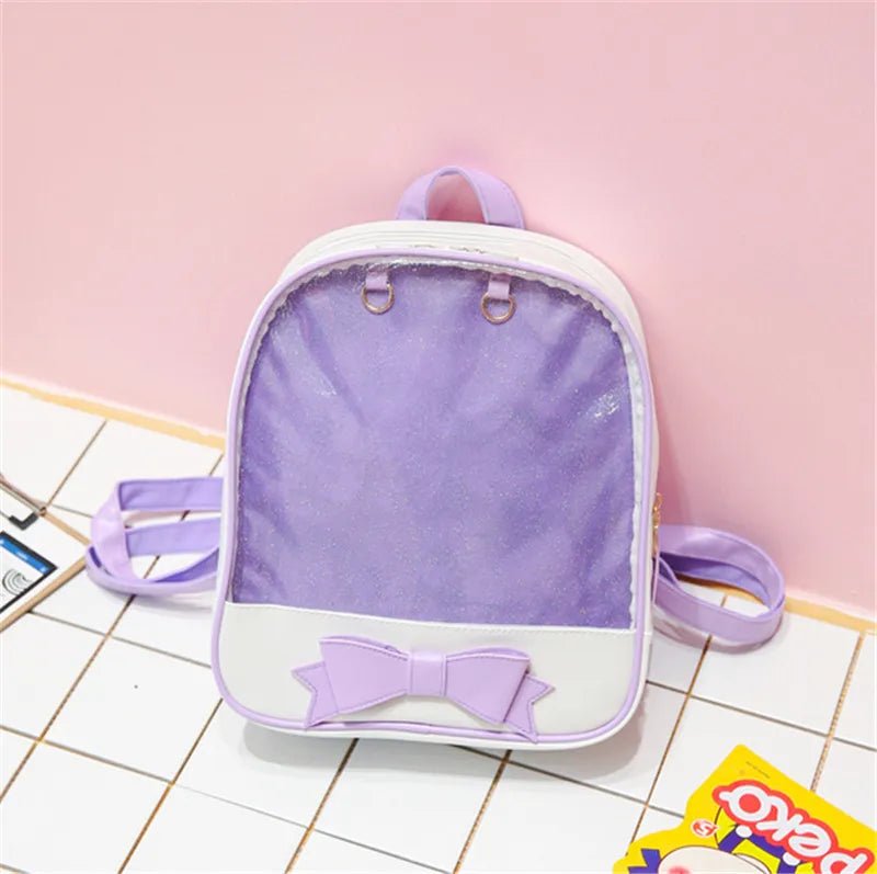 Stylish Clear Itabag with a purple bow for youth backpack styling and outings.