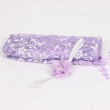 Purple floral newborn headband as a photography prop accessory for baby portraits and milestone photos.