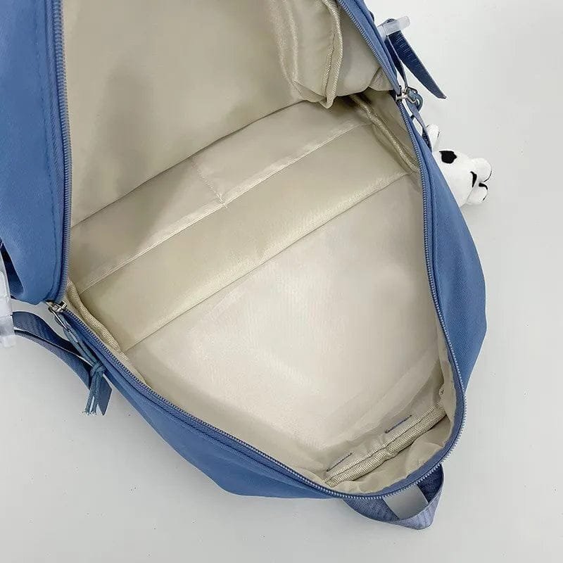 Interior compartments of the purple high school backpack for organising books, folders, and stationery.