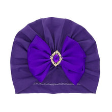 Purple large bow baby turban cap with rhinestone centre for birthdays, photos, and dressy baby looks.