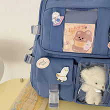 Side profile of the purple school backpack for teen girls, with a padded compartment sized for laptops.