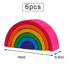 Set of six colorful wooden rainbow blocks with measurements.