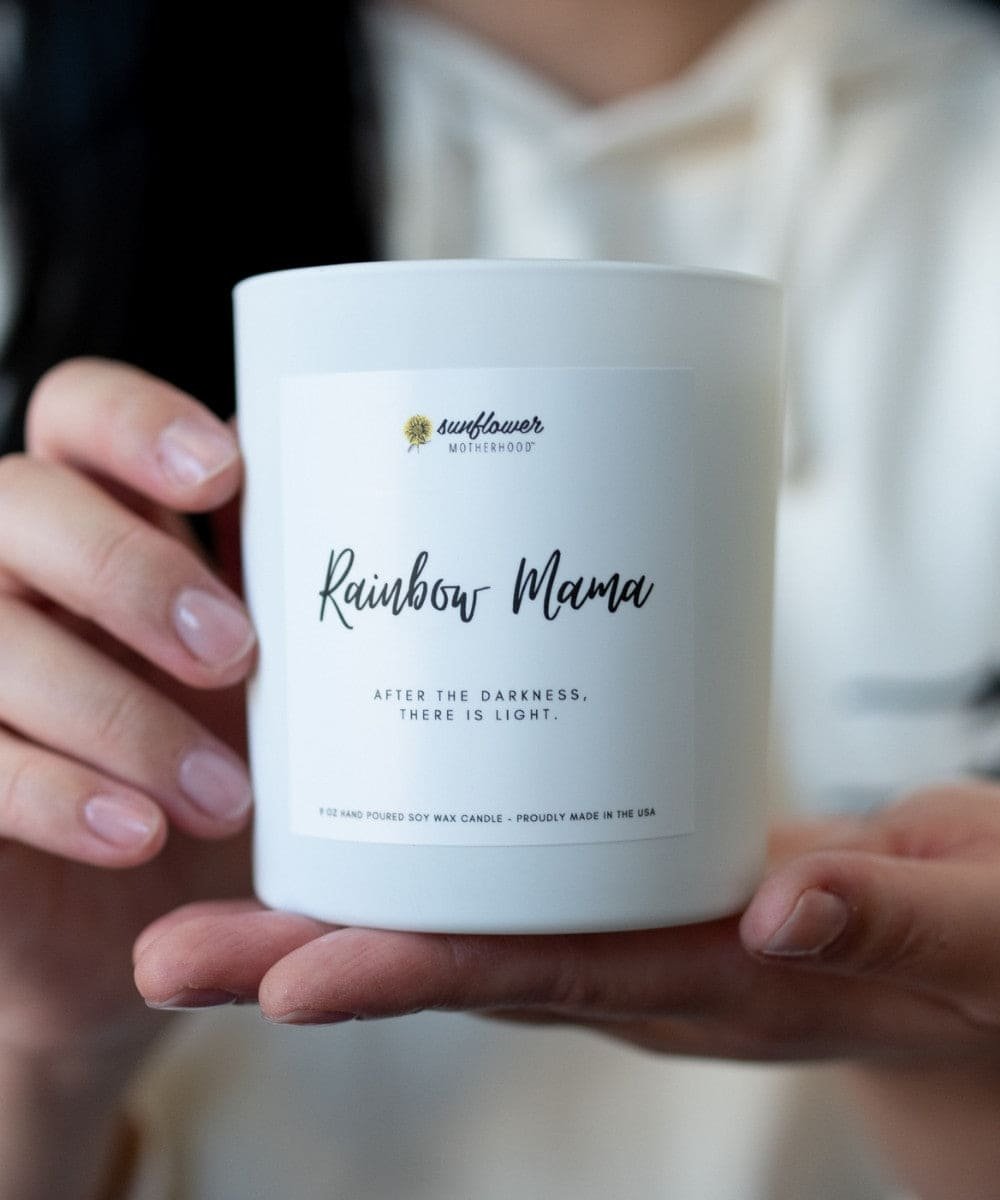 Rainbow Mama Pregnancy Loss Candle held in hand as a sympathy gift for remembrance moments and gentle home comfort.