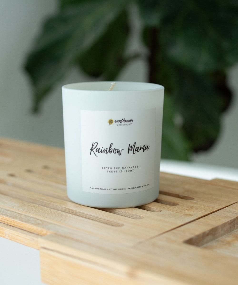 Rainbow Mama Pregnancy Loss Candle on a wooden table as a thoughtful bereavement gift for quiet reflection and healing.