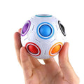 Rainbow Puzzle Ball 3D brain teaser toy held in hand for problem solving practice, travel play, and screen-free fun.