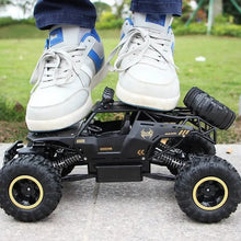 Load test of the RC buggy chassis taking an adult step, showing durable construction for rough kids play.