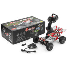 Off-road 4WD RC crawler vehicle with remote control and accessories for outdoor racing.