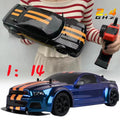 1:14 scale 4WD RC drift car and remote control held by hand showing true size for outdoor play.