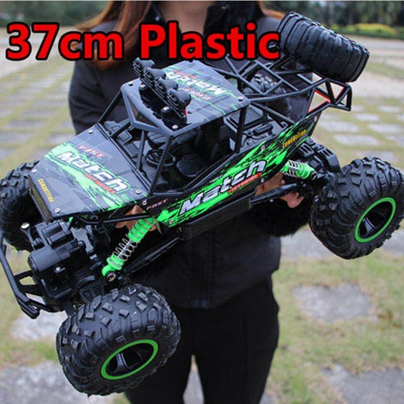 2.4G 4WD RC monster truck demoed at full scale for outdoor off-road play sessions.