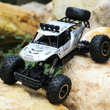RC off-road truck climbing a rock obstacle, a 4WD buggy toy for outdoor exploring and terrain challenges.