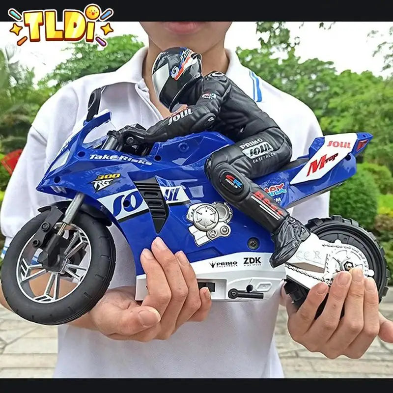 A Person holding a blue toy motorcycle 