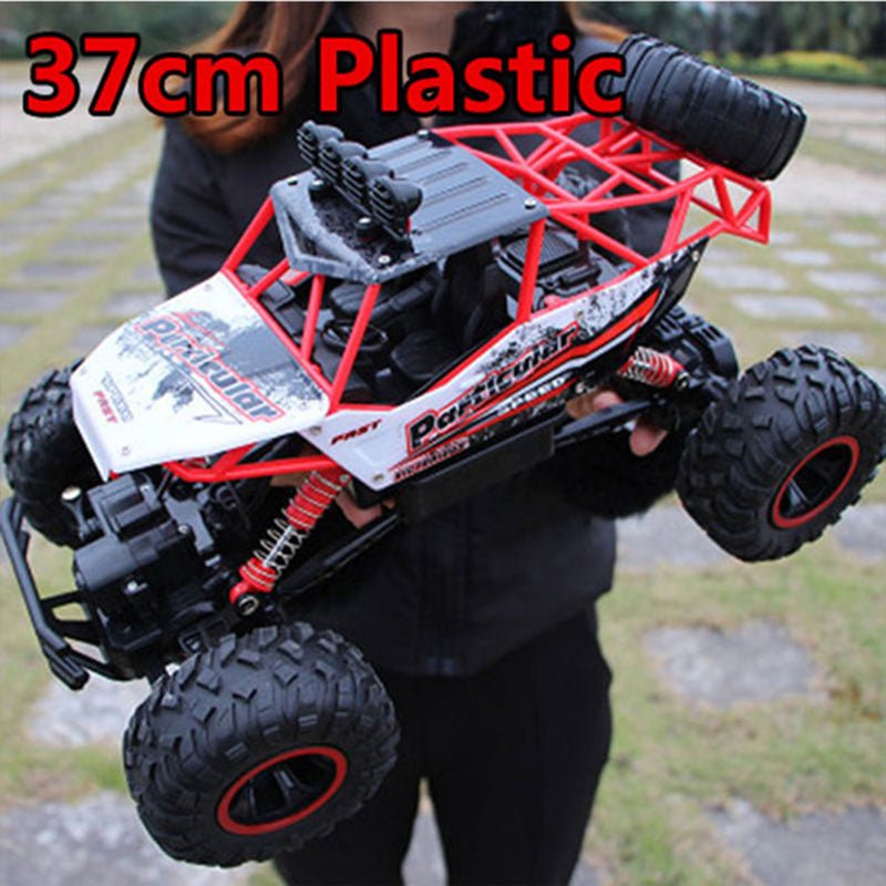 All-terrain RC truck plastic body version held by hand for size reference before purchase.