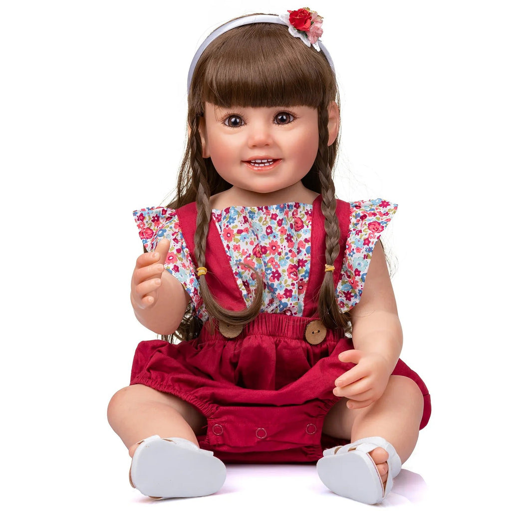 Realistic Cammi Smile Reborn Doll in soft silicone wearing a floral top and red dress for pretend play and doll collecting.